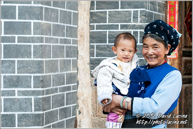 Bai Elderly Woman With Baby - Dali And Erhai Lake, China
