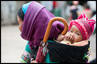 Yi Woman And Baby, Tribal Local Market, China